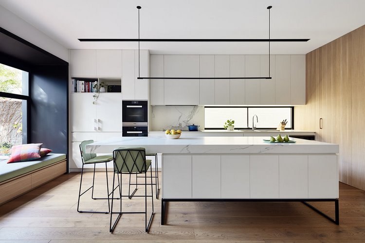 minimalist suspended light fixture above kitchen island