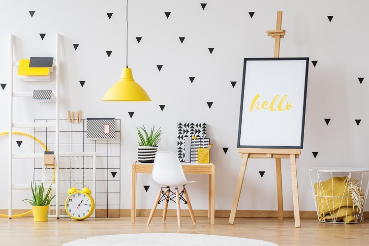 scandinavian style nursery room with yellow lamp