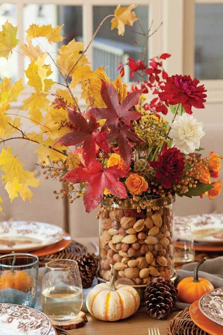 festive table decorating ideas vase with nuts and tree branches