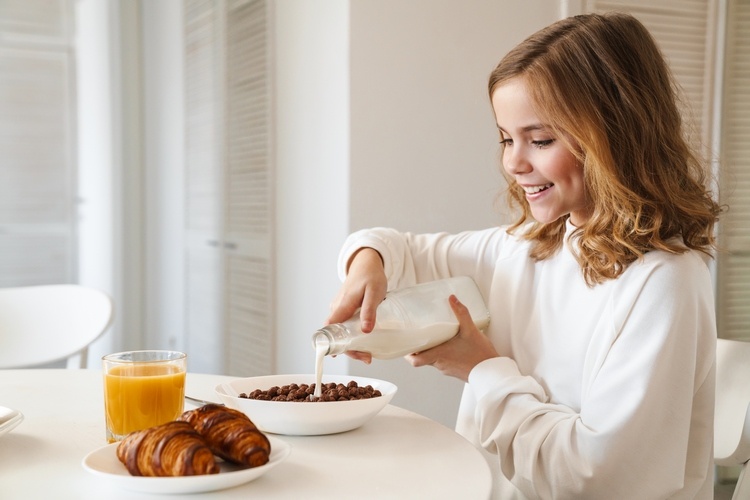 girl having breakfast homeschooling tips for parents