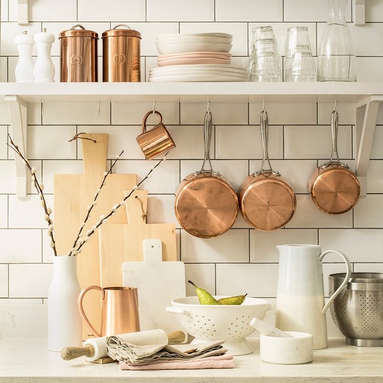 Hooks under cabinets and open kitchen shelves are very practical