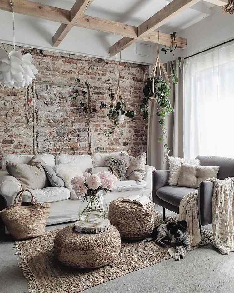 boho living room with exposed brick wall and ceiling beams