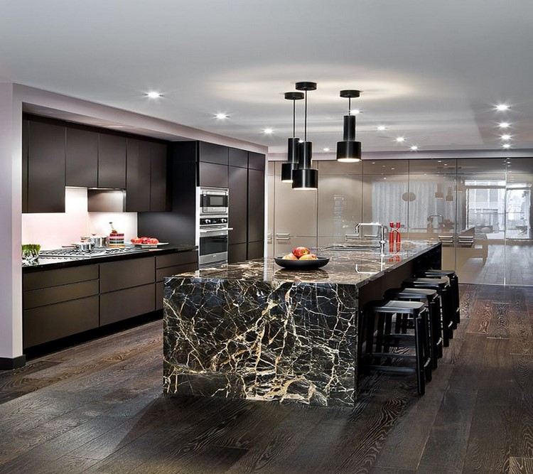 large black and gold kitchen island with seating in modern kitchen