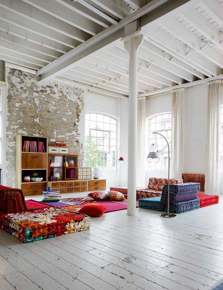 low seating furniture in large living room decorated in boho style