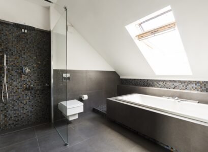 modern-attic-bathroom-with-skylight-above-bathtub-and-walk-in-shower