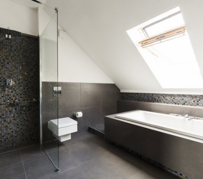 modern-attic-bathroom-with-skylight-above-bathtub-and-walk-in-shower