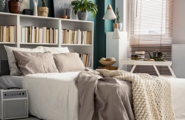 small-bedroom-with-bookcase-as-headboard