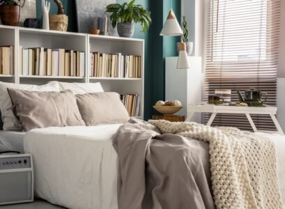 small-bedroom-with-bookcase-as-headboard