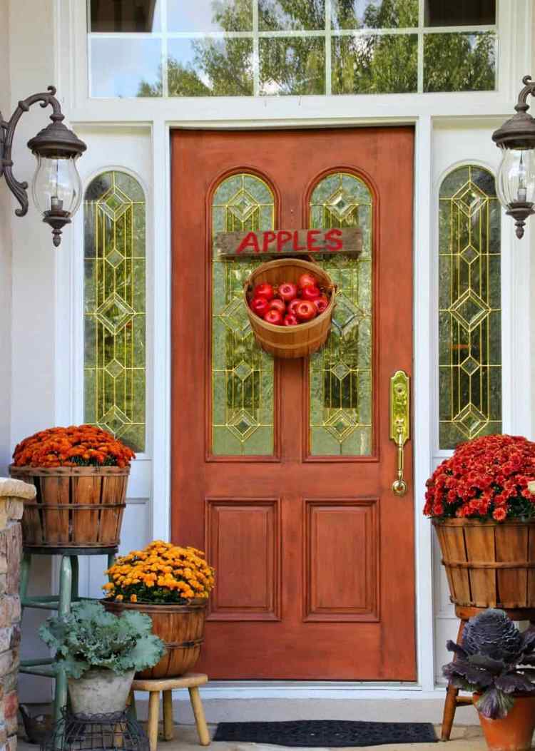 Fall Decorated Porch blooming flowers and apples