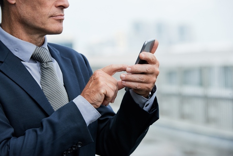 businessman using mobile phone app