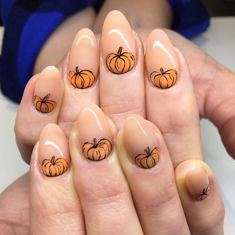 half moon nude nail art with pumpkin decoration