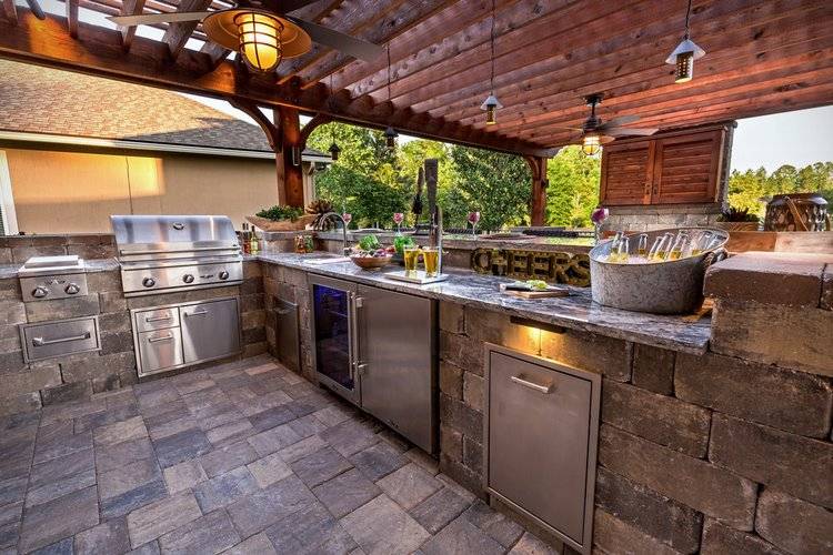 A modern gas grill is a complement to any backyard kitchen