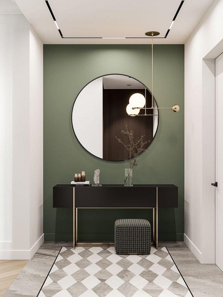 accent wall in hallway large round mirror