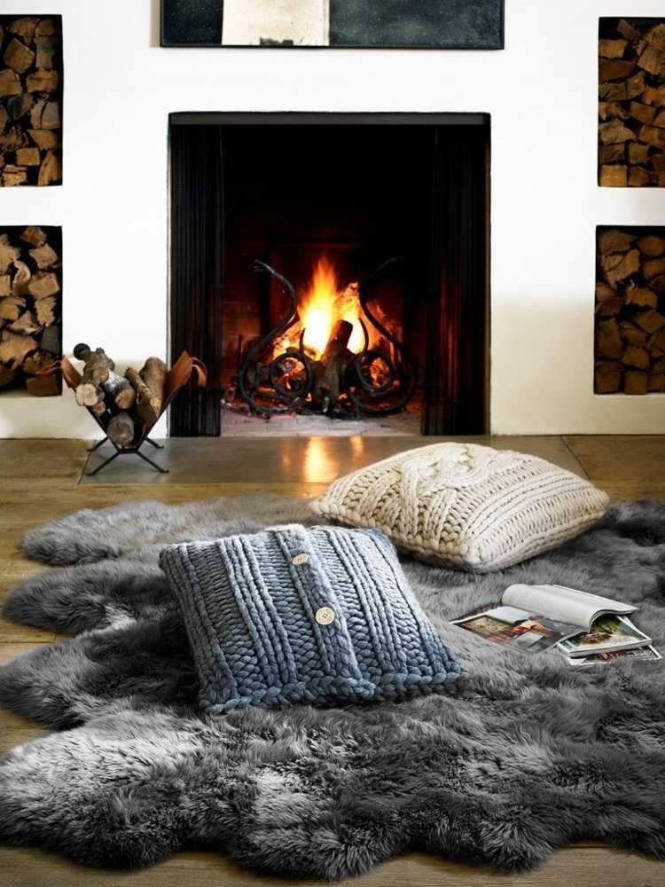 hygge living decor fireplace fur pillow book