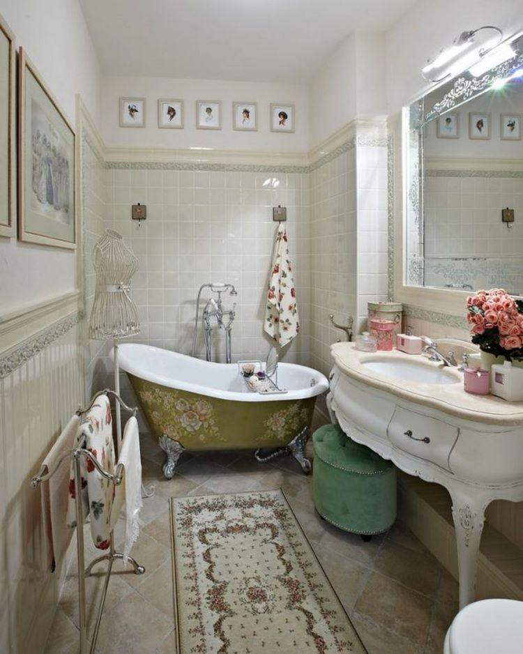 Provence style bathroom with clawfoot tub and white vanity