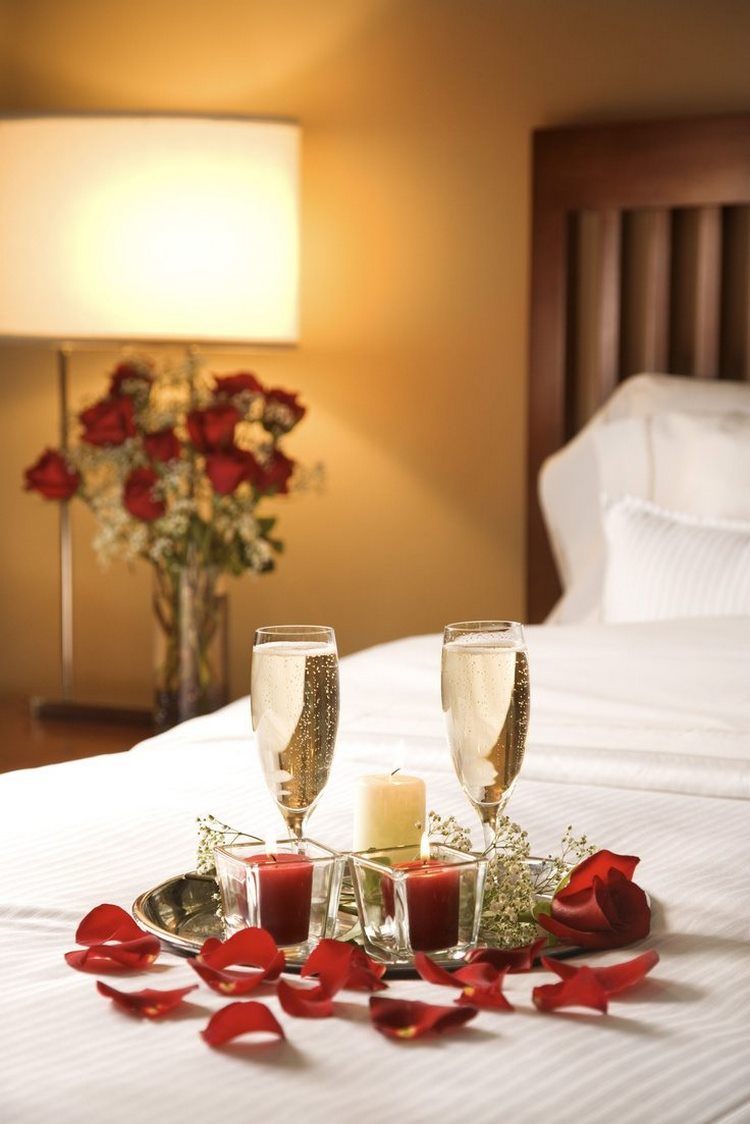 romantic bedroom decor petals candles champagne