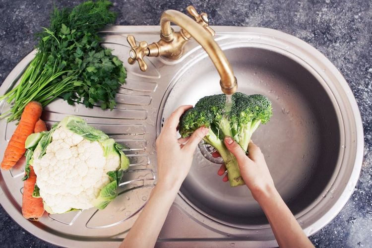 wash vegetables under running water to remove pesticides