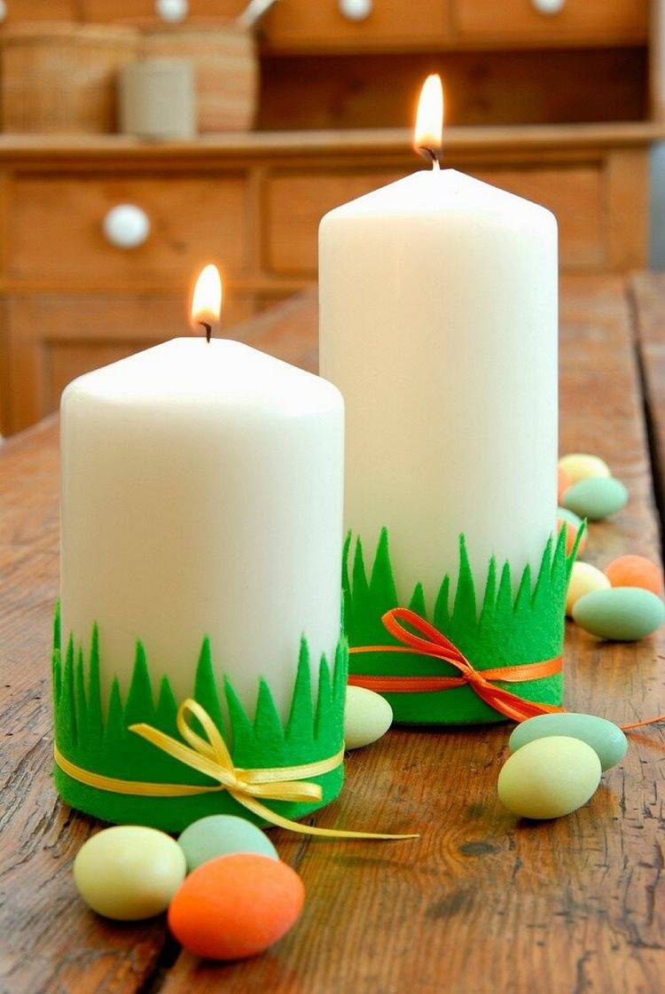 DIY Easter decorations pillar candles decorated with green strips of felt