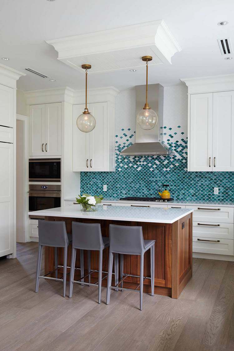 kitchen backsplash with random fish scale tiles of different shades
