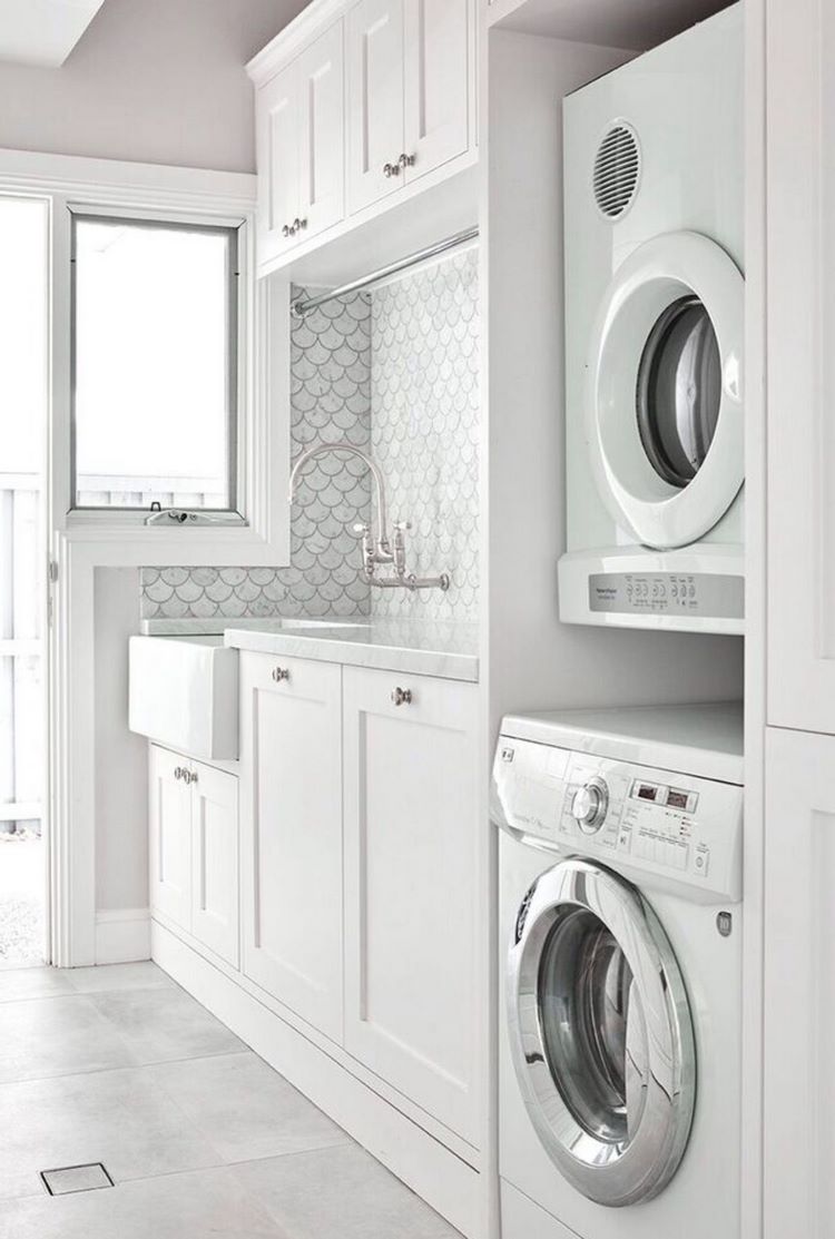 laundry room ideas wall tile white cabinets