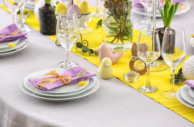 lovely eater tablescape yellow table runner purple napkins