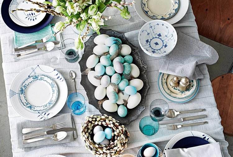 pastel blue Easter Tablescape colored eggs flowers