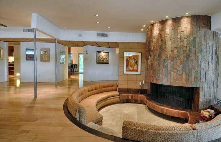 spectacular sunken living room in front of fireplace