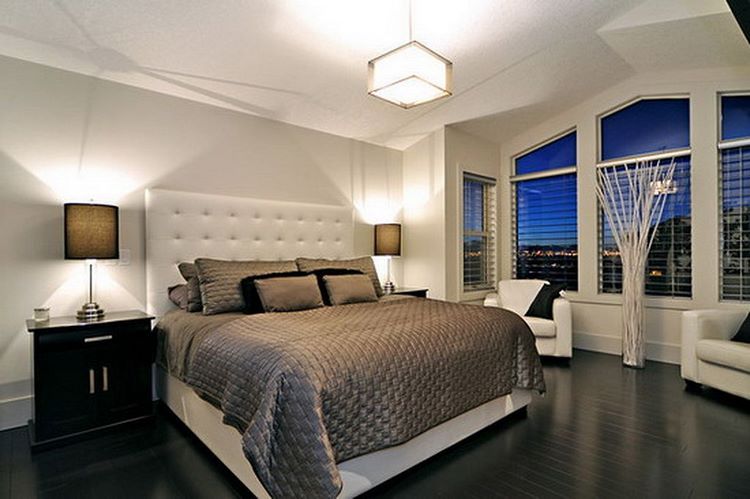 bedroom interior in contrasting colors dark floor white walls and ceiling