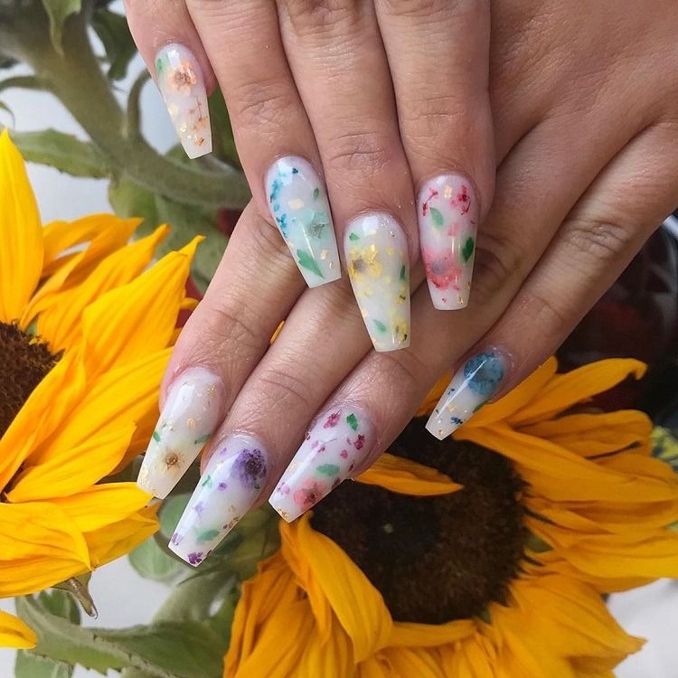 milk bath nails decorated with dried flowers