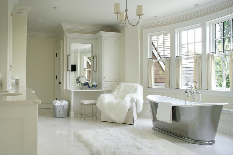 white area rug beside freestanding tub