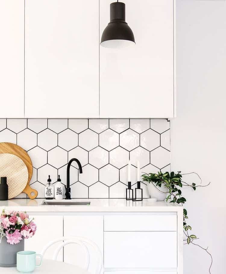 white hexagonal tile and dark grout kitchen backsplash