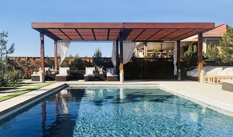 pergola by the pool provides shade and privacy