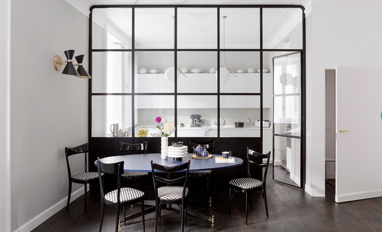 glass kitchen partition lets natural light in the room