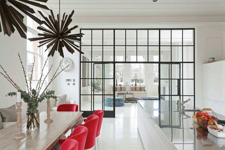 kitchen with interior glass partition dining table red chairs