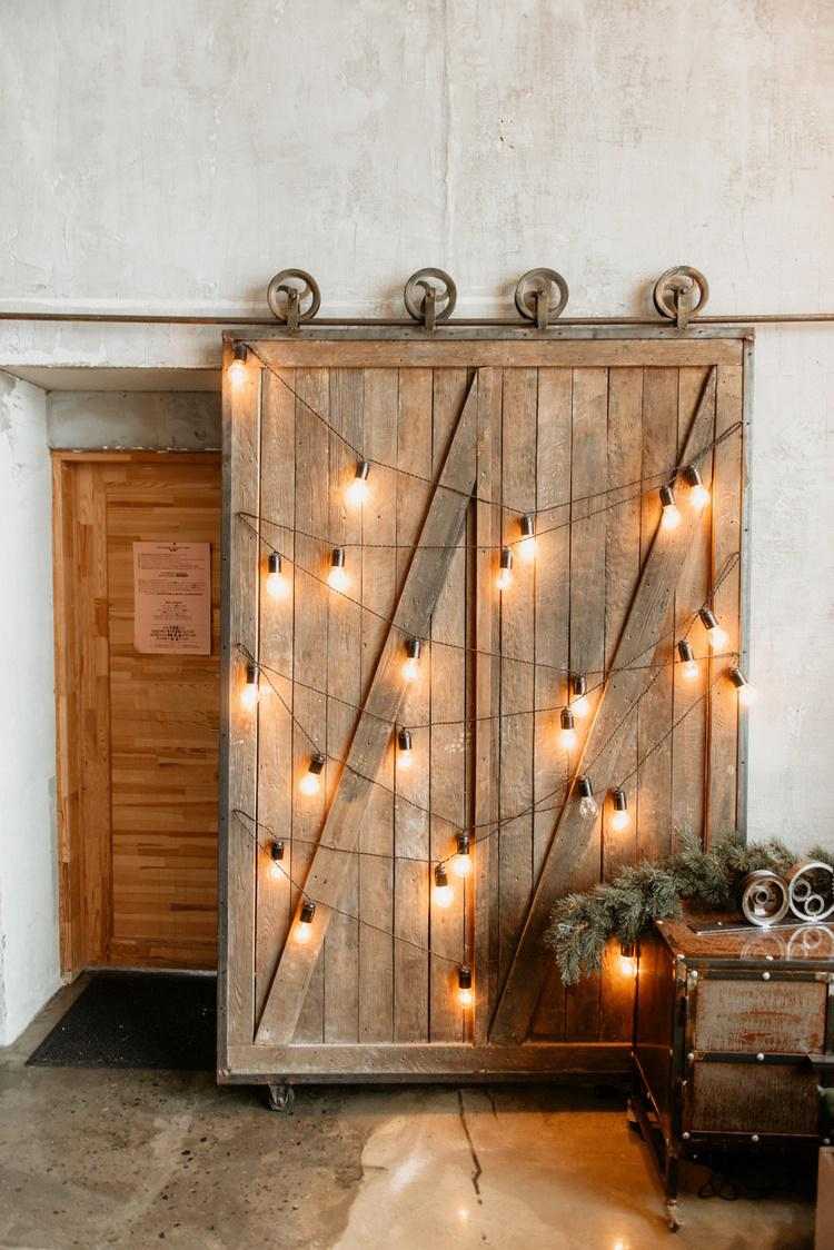 sliding barn door decorated with string lights