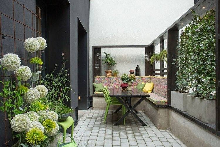 balcony rooftop urban garden with dining area dark wood dining table