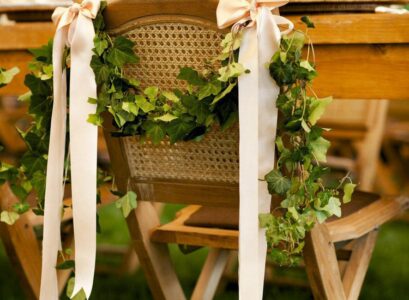 beautiful-wedding-chair-decor-ideas-greenery-garland-and-satin-ribbons