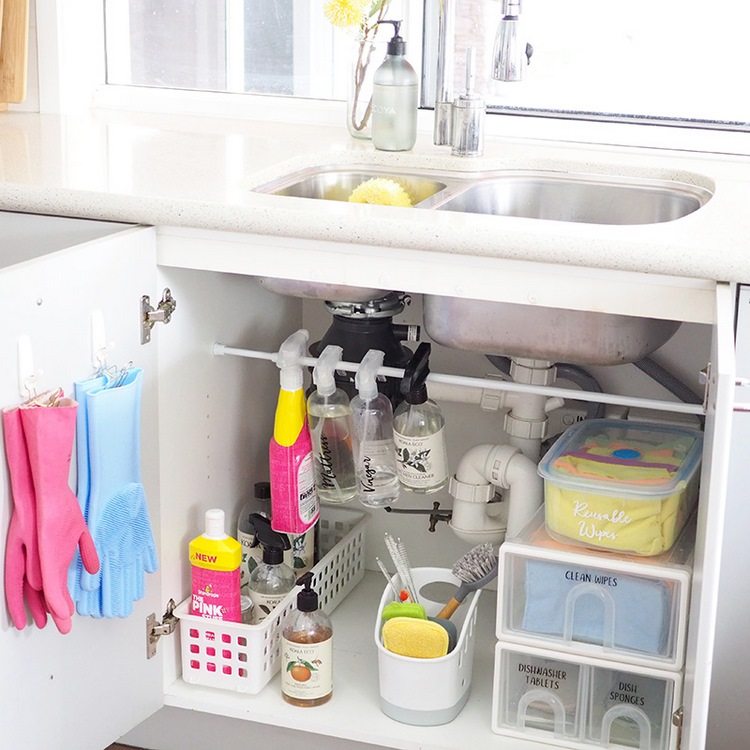 Tension Rod hooks and plastic containers under the sink