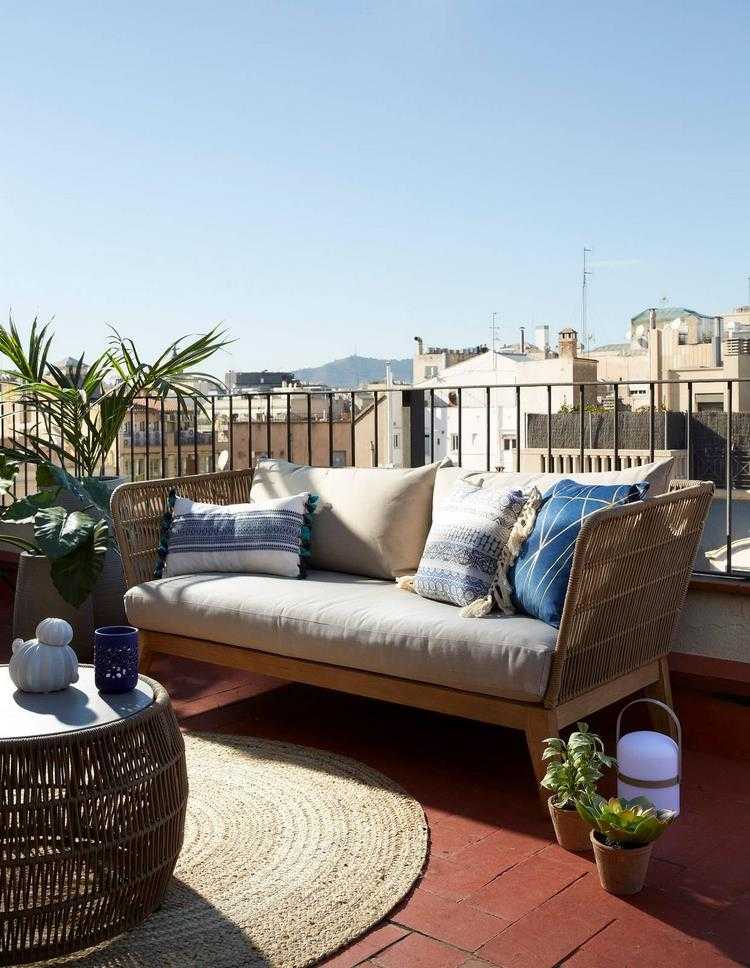 balcony with sofa and round coffee table