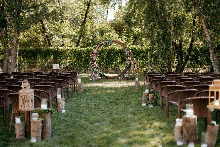 garden wedding ceremony area arch decoration with flowers