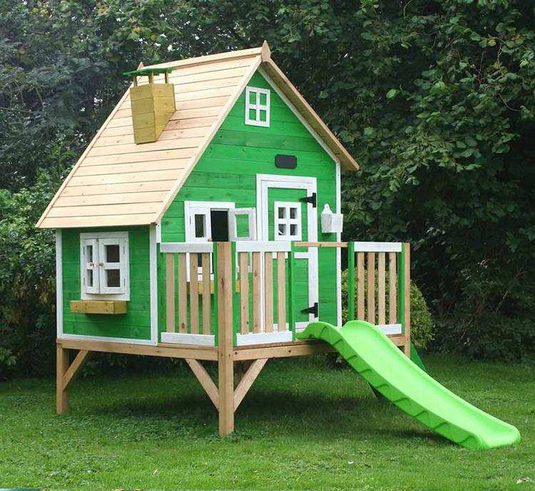 play house with slide in the backyard