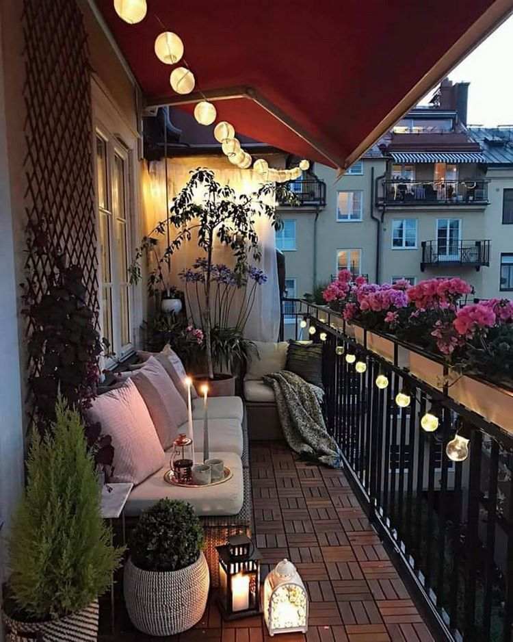 string lights on balcony sofa lanterns