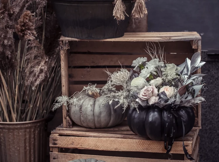 outdoor fall decor with crates pumpkins and flowers