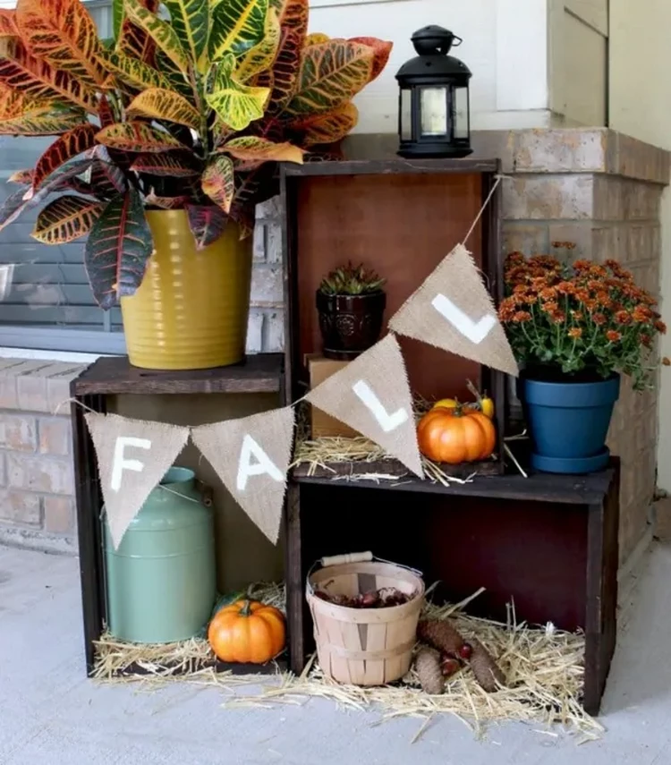 fall crate display DIY decorative composition with flowers and pumpkins