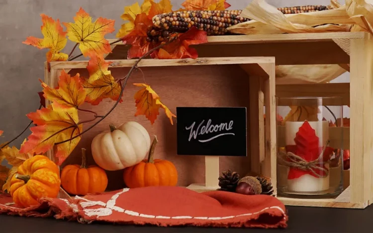 fall crate display ideas colored leaves pumpkins candle