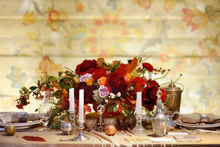 autumn wedding table fresh flowers and candles centerpiece