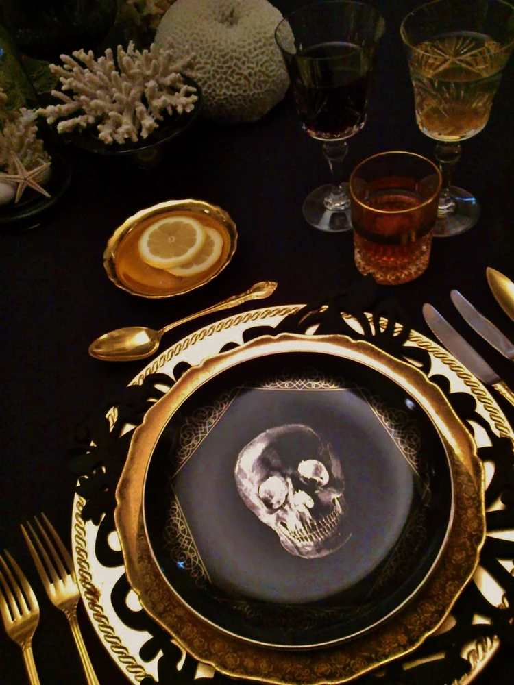 spooky chic halloween tablescape in black and gold