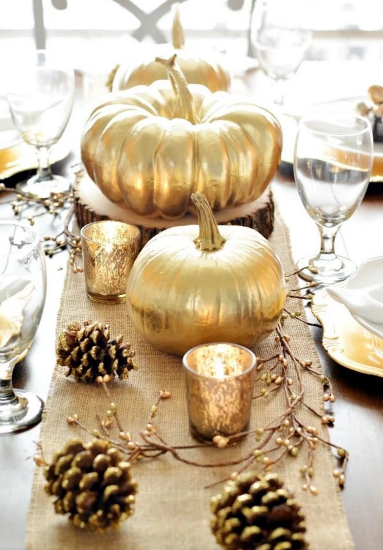 gold pumpkins and pinecones Thanksgiving table centerpiece