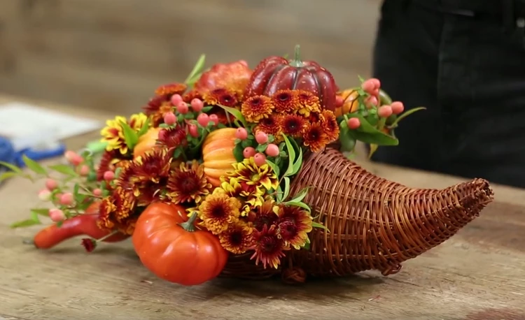 thanksgiving cornucopia arrangement with fresh fall flowers