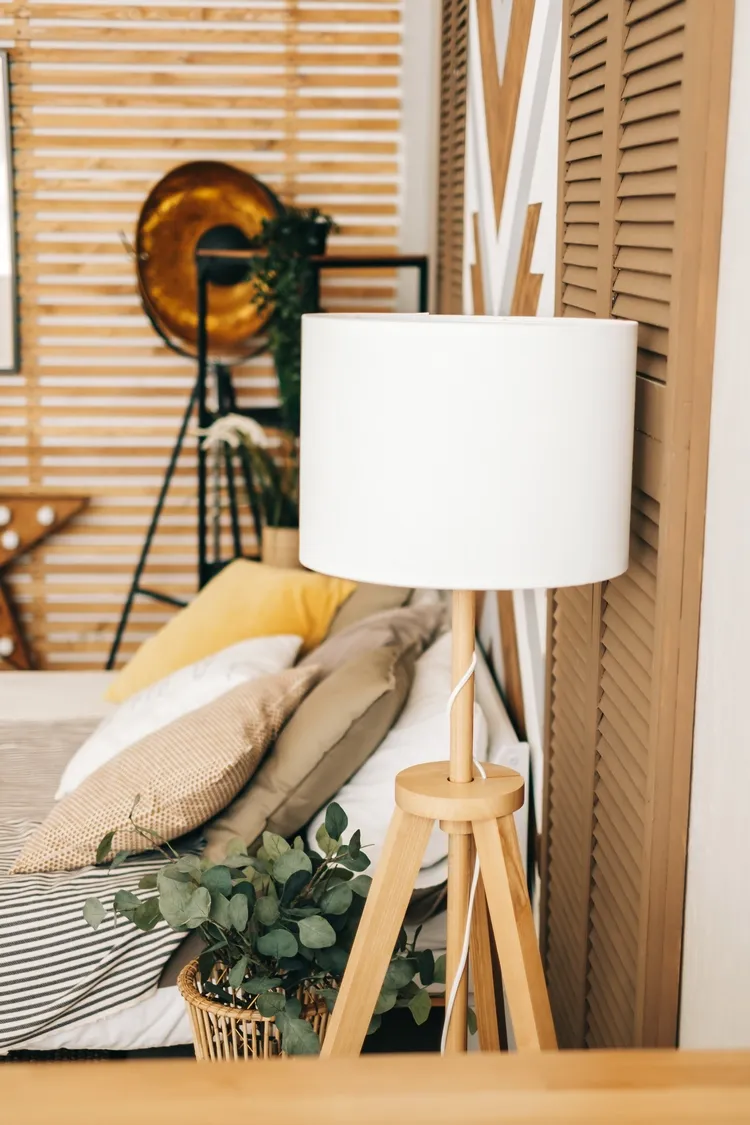 wooden floor lamp in bedroom